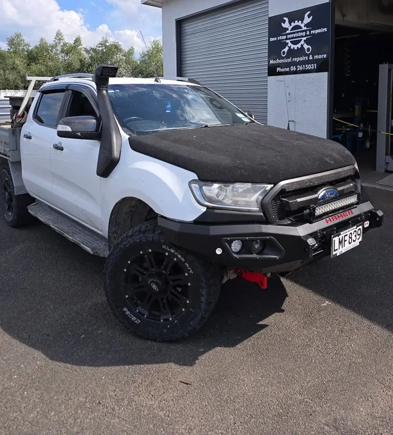 Ford Ranger with new bull bar, light bar and snorkel outside the workshop